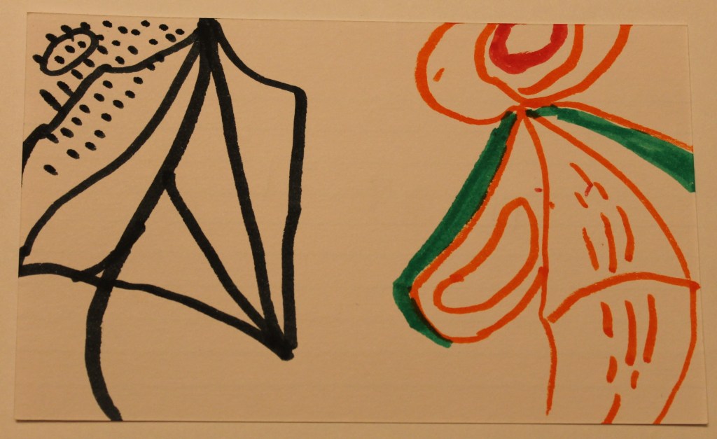 Stylized image in black and orange. resembles a kite or a leaf and a person in a cape.