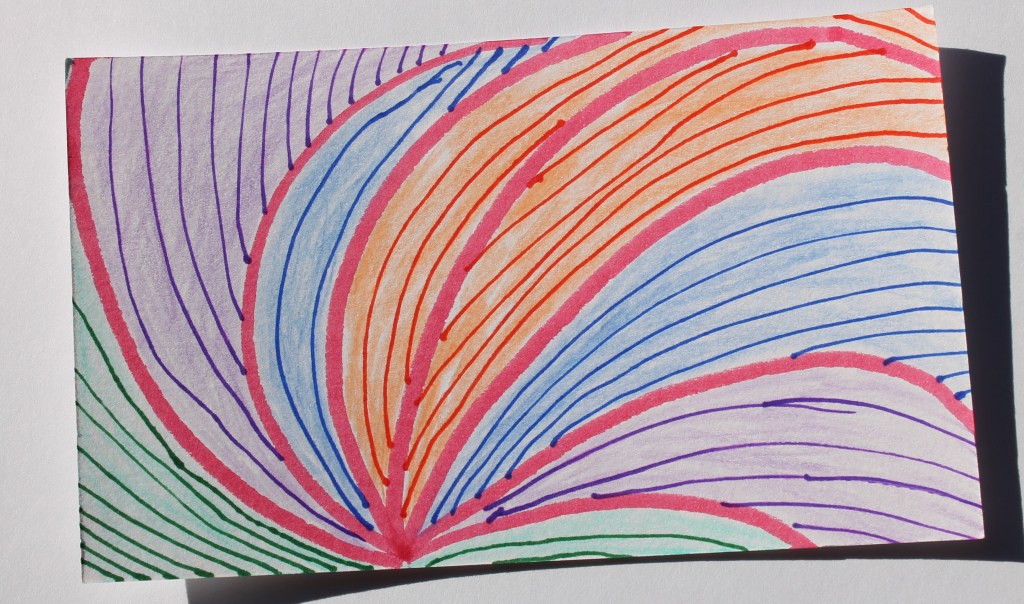 Dark pink lines curling out from a single point at the bottom of the image, creating segments that are each colored with pencil in green, purple, blue or orange. Each segment is divided by arcs of colored pen in curving parallel lines. The overall effect suggests a feather or flower.